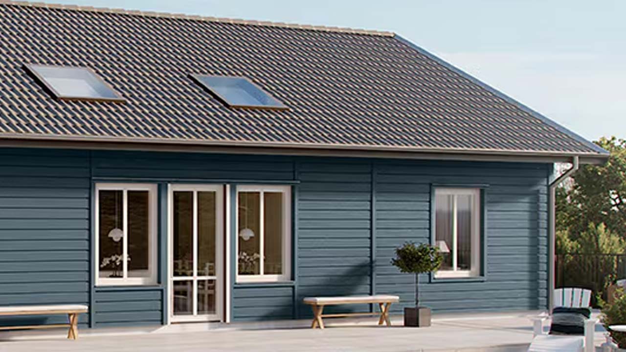 Bl&aring; facademaling p&aring; facadebekl&aelig;dning af tr&aelig;